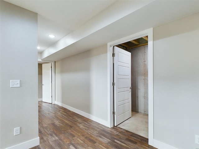 hall with hardwood / wood-style flooring