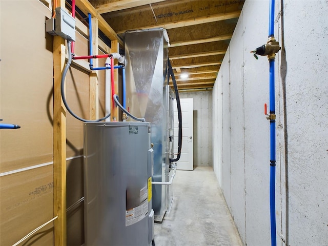 utility room featuring water heater