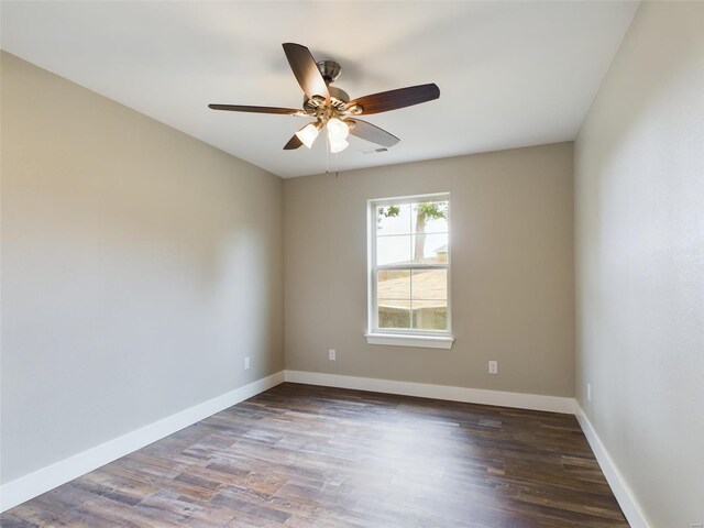 unfurnished room featuring dark hardwood / wood-style floors and ceiling fan