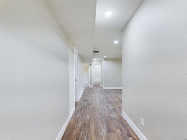 hall with dark hardwood / wood-style floors