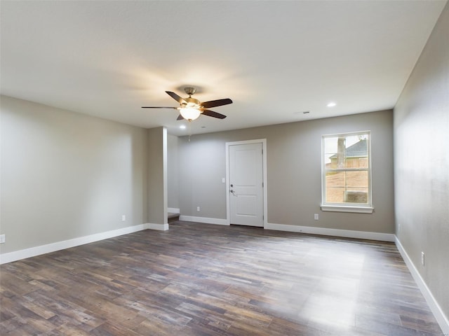 spare room featuring ceiling fan and hardwood / wood-style flooring