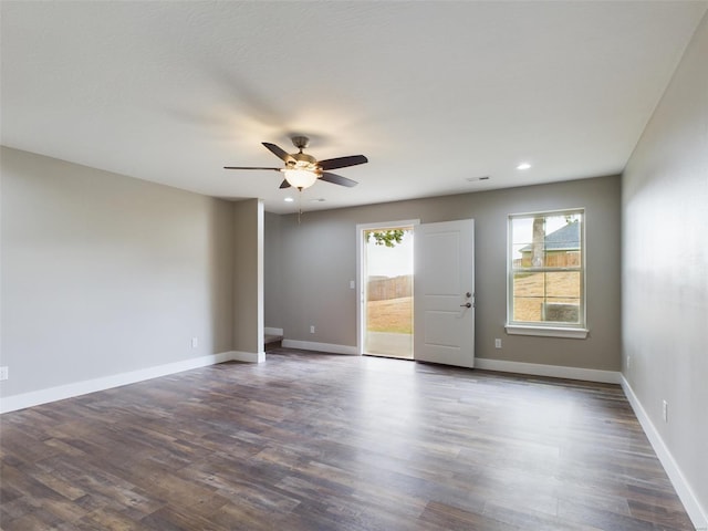 unfurnished room with ceiling fan and dark hardwood / wood-style floors