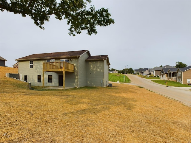 rear view of house with a lawn