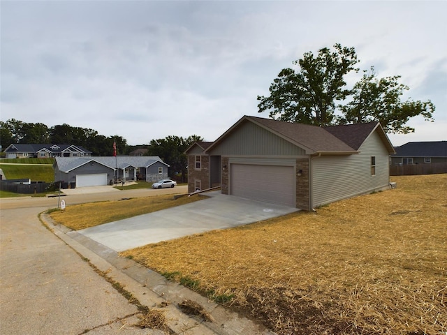 view of front of home featuring a front yard and a garage