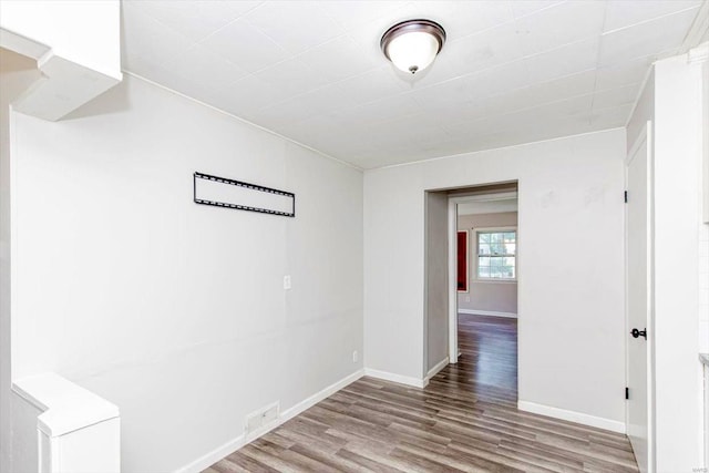 empty room with wood-type flooring