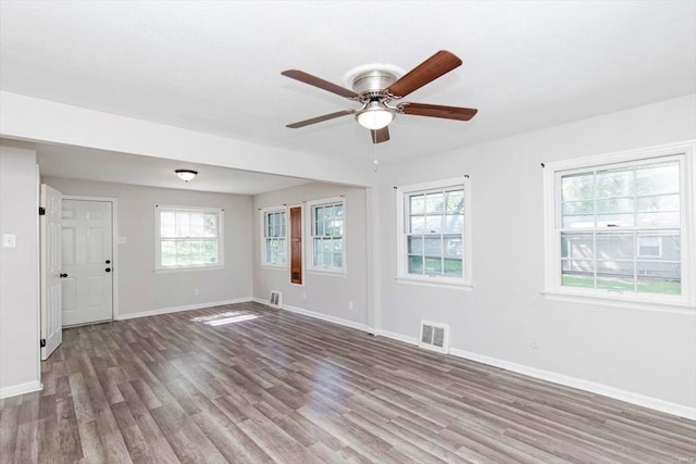 empty room featuring ceiling fan and wood-type flooring