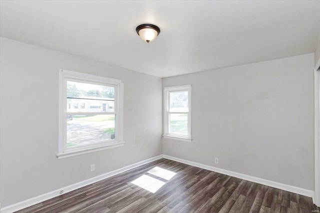 unfurnished room featuring hardwood / wood-style flooring