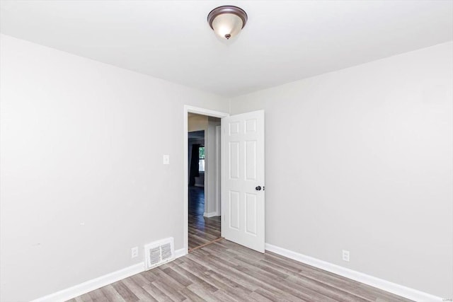 spare room with light hardwood / wood-style floors