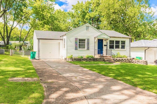 view of front of home featuring a garage and a front yard