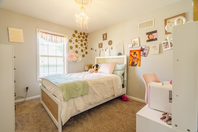 carpeted bedroom featuring a chandelier