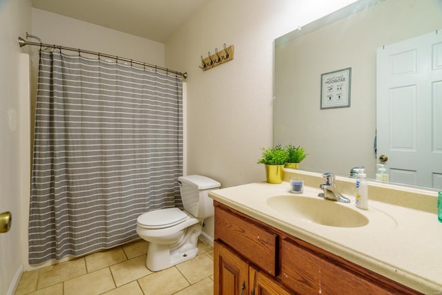 bathroom featuring tile patterned floors, vanity, and toilet