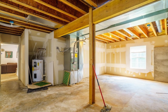 basement featuring water heater and heating unit