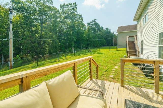 wooden terrace with a yard