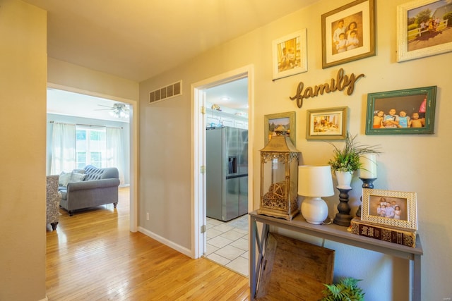 hallway featuring light hardwood / wood-style flooring