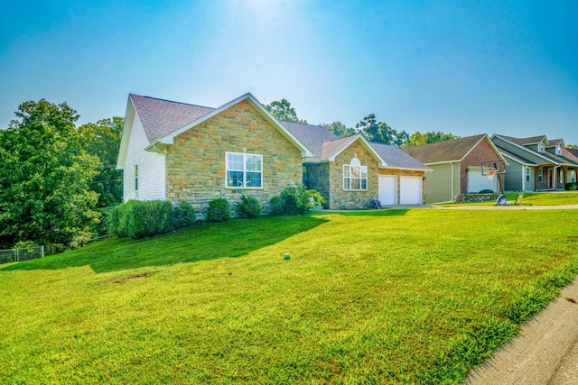 ranch-style home with a garage and a front yard