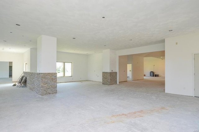 empty room featuring unfinished concrete flooring