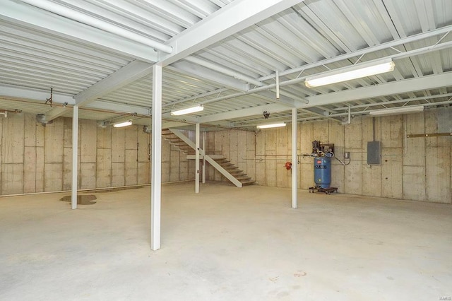 below grade area with stairway and electric panel