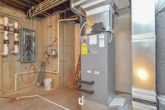 utility room featuring heating unit