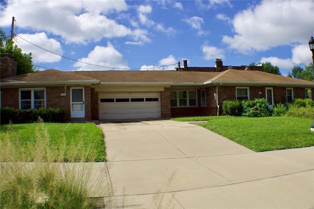 ranch-style home with a front yard and a garage