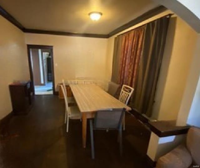 dining room featuring ornamental molding