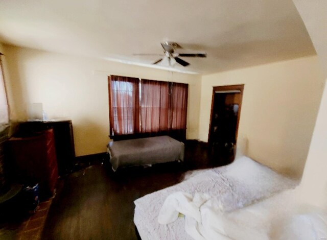 bedroom featuring ceiling fan and dark hardwood / wood-style floors