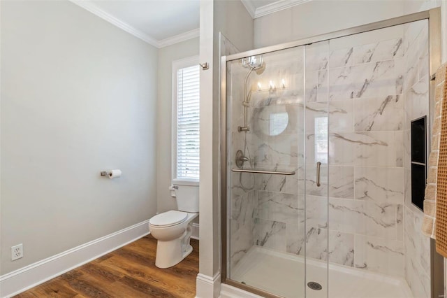 bathroom with a marble finish shower, toilet, ornamental molding, wood finished floors, and baseboards