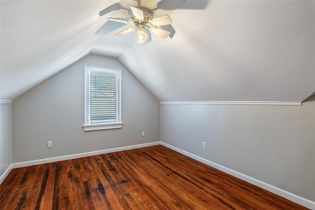 additional living space with lofted ceiling, ceiling fan, baseboards, and wood finished floors