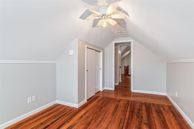 bonus room with a ceiling fan, lofted ceiling, baseboards, and wood finished floors