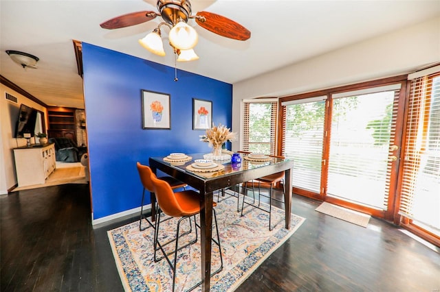 dining area with dark wood-type flooring