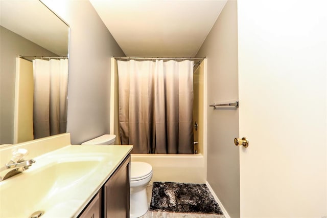 full bathroom featuring shower / tub combo with curtain, toilet, and vanity