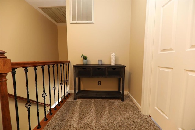 hallway with carpet flooring