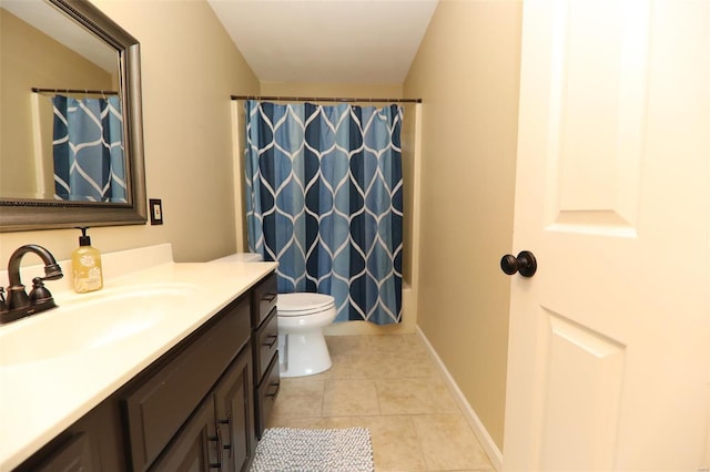 full bathroom featuring shower / tub combo with curtain, toilet, vanity, and tile patterned flooring