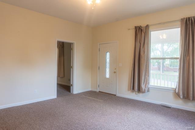 view of carpeted entrance foyer