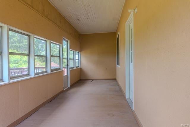 hall with light hardwood / wood-style flooring