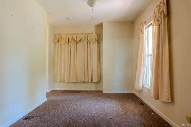 unfurnished room with carpet flooring