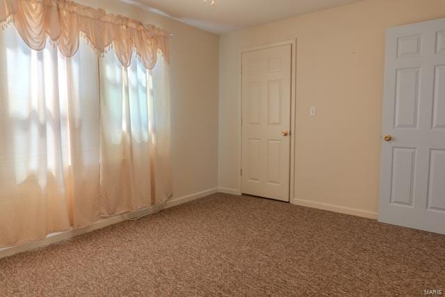 spare room with light colored carpet