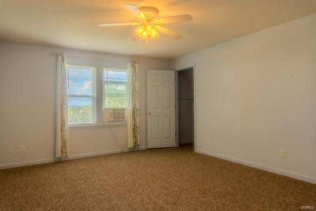 spare room featuring ceiling fan and light colored carpet