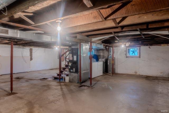 basement with independent washer and dryer and heating unit