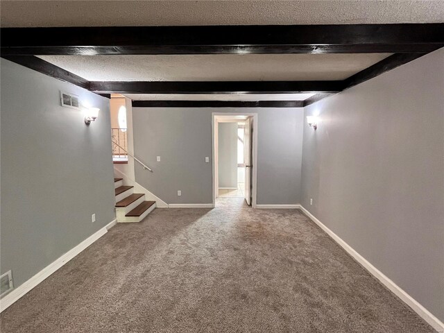 basement with a textured ceiling and carpet floors