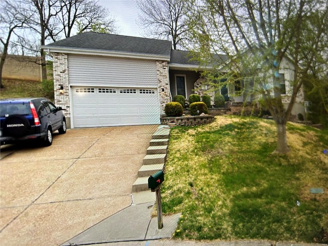 single story home featuring a front yard and a garage