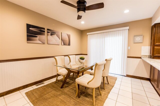 dining room featuring ceiling fan and light tile patterned floors