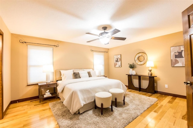 bedroom featuring light hardwood / wood-style floors and ceiling fan