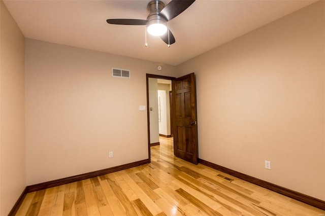 empty room featuring light wood-type flooring and ceiling fan