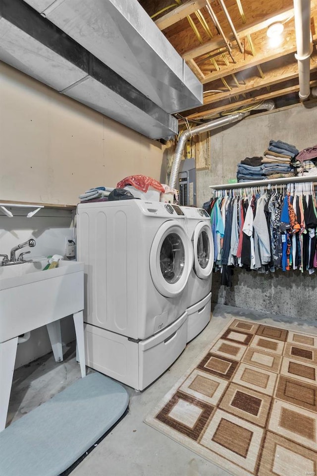 laundry area with separate washer and dryer and electric panel