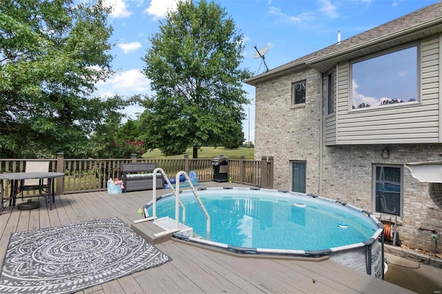 view of pool with a deck