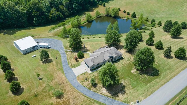 birds eye view of property featuring a rural view and a water view