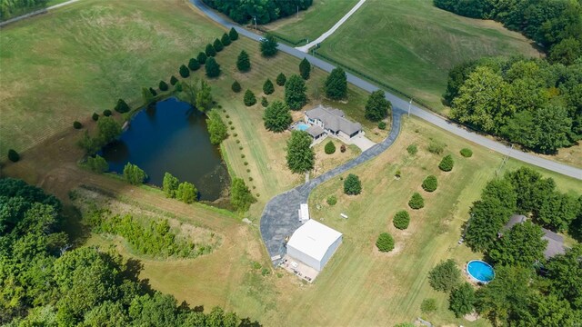 birds eye view of property with a rural view and a water view