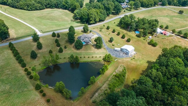 birds eye view of property featuring a rural view and a water view