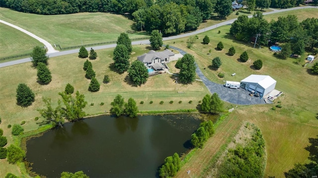 birds eye view of property featuring a rural view and a water view