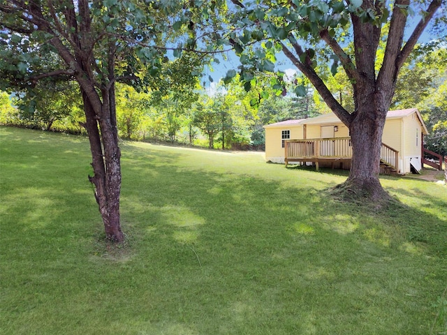 view of yard featuring a wooden deck